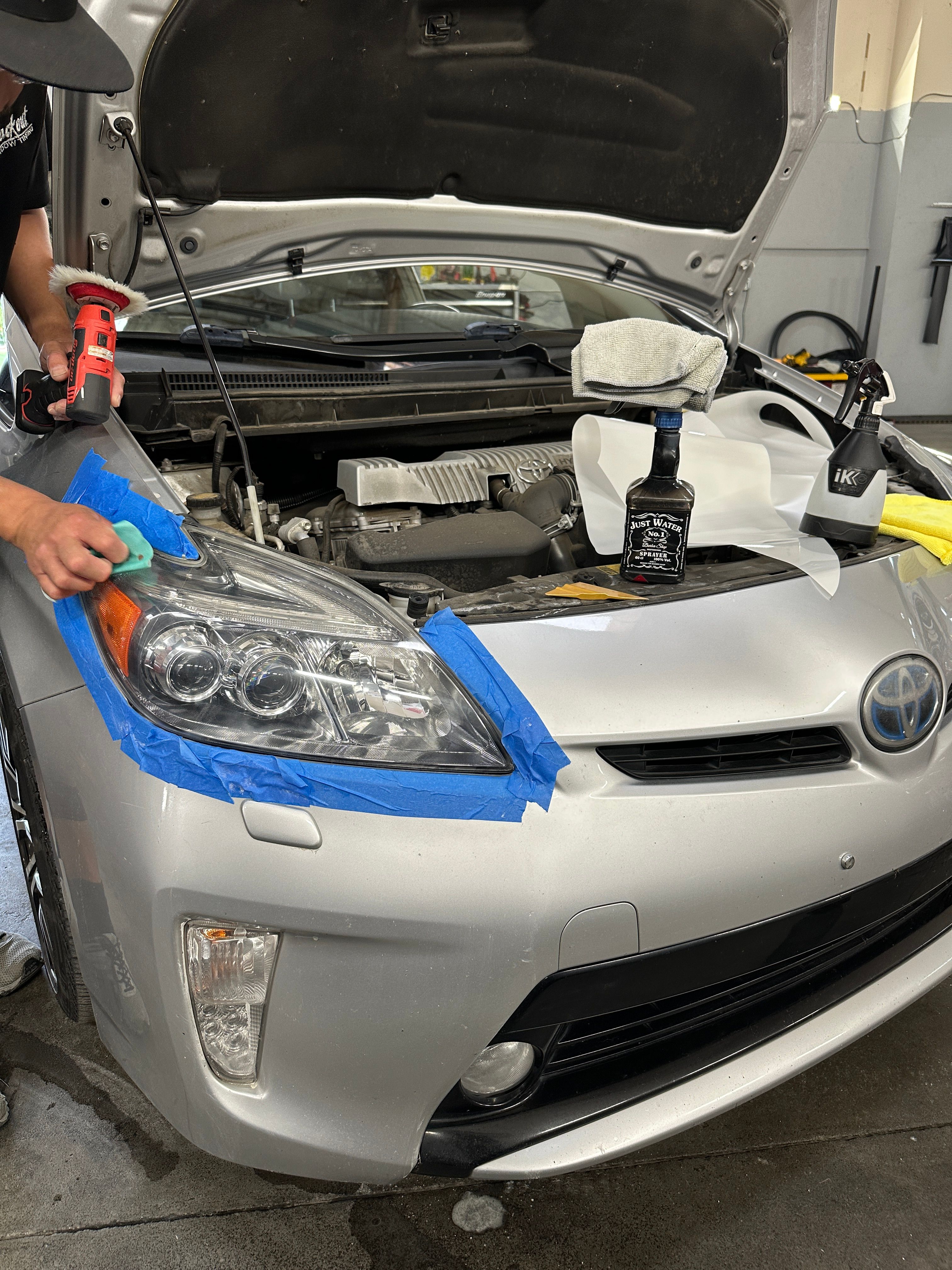 Professional headlight restoration before and after at Blackout Window Tinting